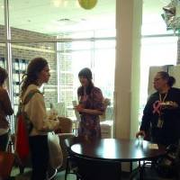 4 women conversing in the women's center